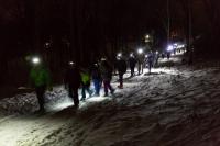 People outside in the dark.